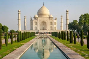 Taj Mahal in Agra with its white marble dome, four minarets, reflecting pool, and Mughal gardens